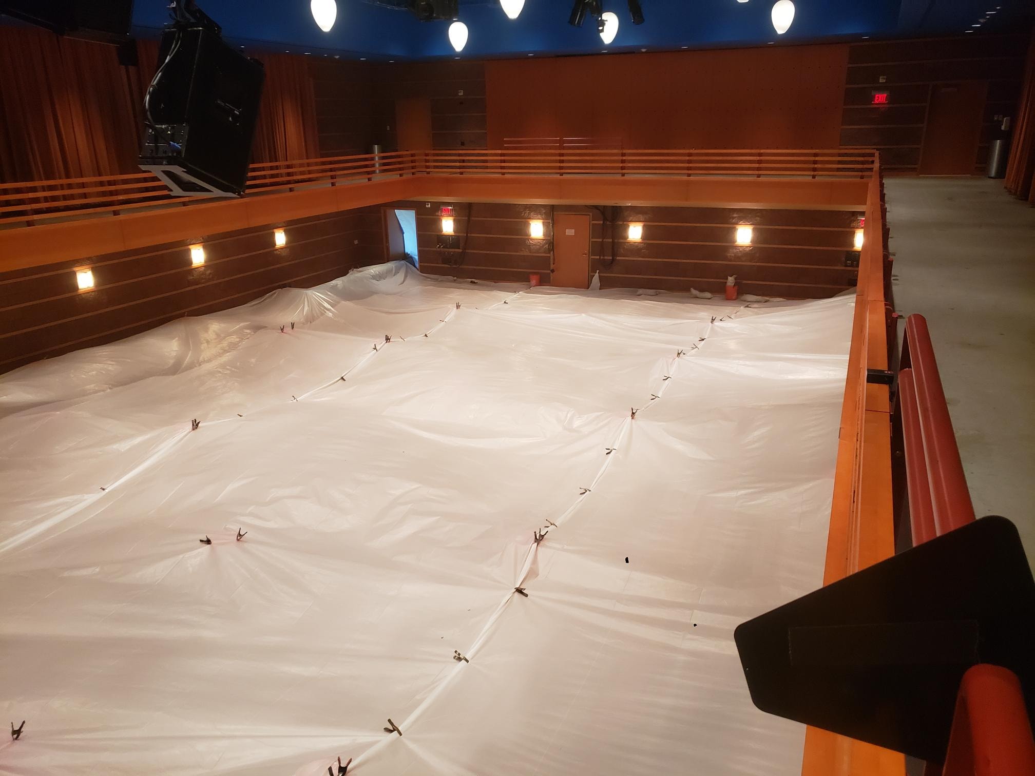 plastic tarping positioned over flooring